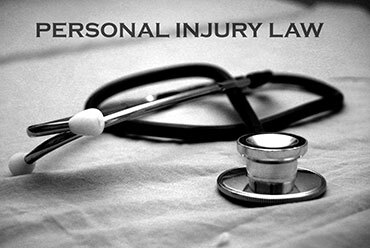 Stethoscope on a table representing medical aspects of Personal Injury Law - The Law Offices of Luke T. Moreau, ESQ.